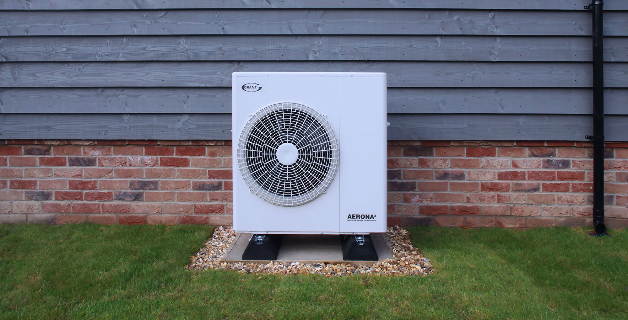 Aerona Air Source Heat Pump An Aerona Air Source Heat Pump outside a building.