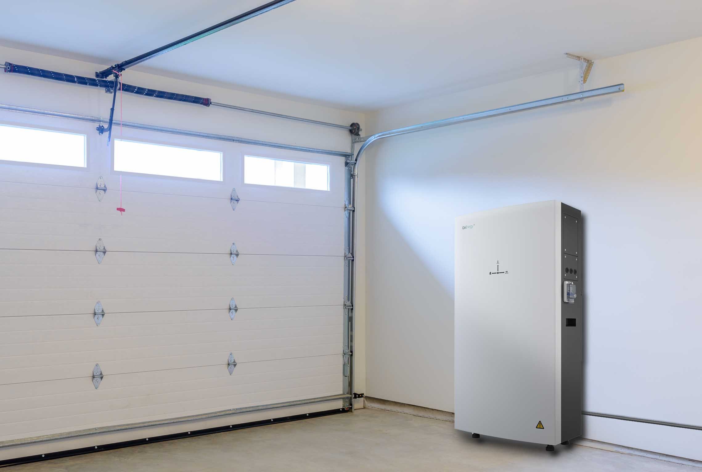 Empty Garage Solar Battery A solar battery in a garage with the door closed.