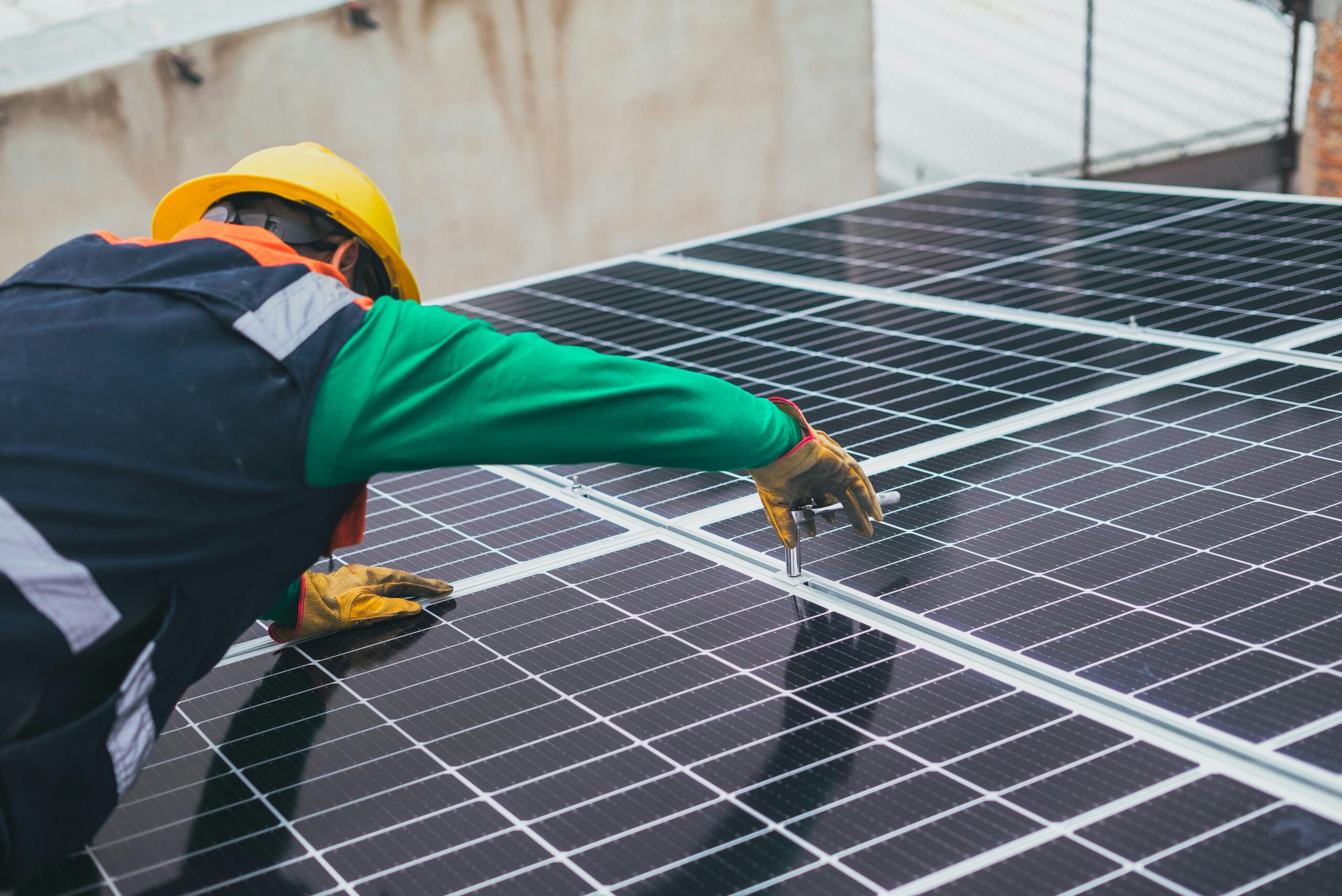 Hard Hat Man Panels A man in a hard hat working on Solar Panels.