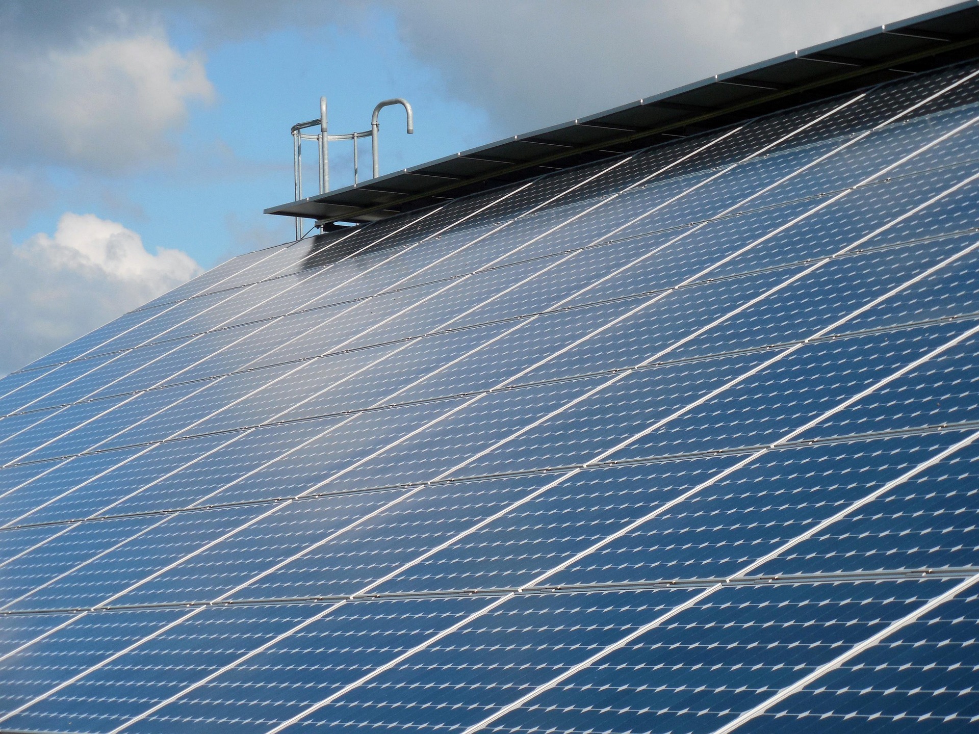 Rooftop Solar Panel Ladder Rooftop commercial solar panels with a ladder in the background.