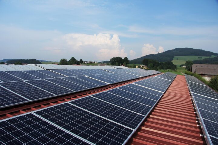 A man holding a solar panel.