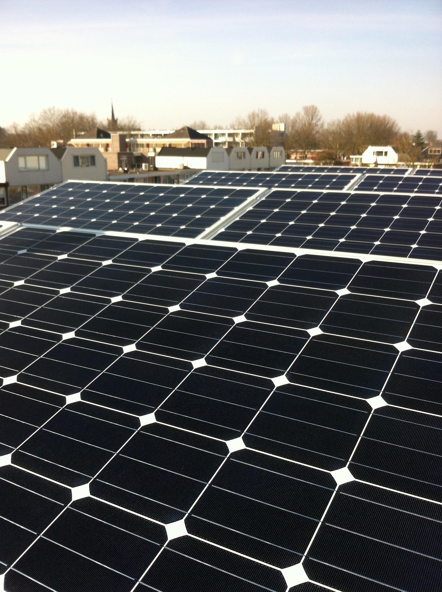 Solar Panels on the roof of a building in a town.
