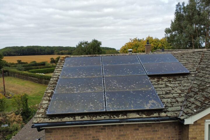 A man holding a solar panel.