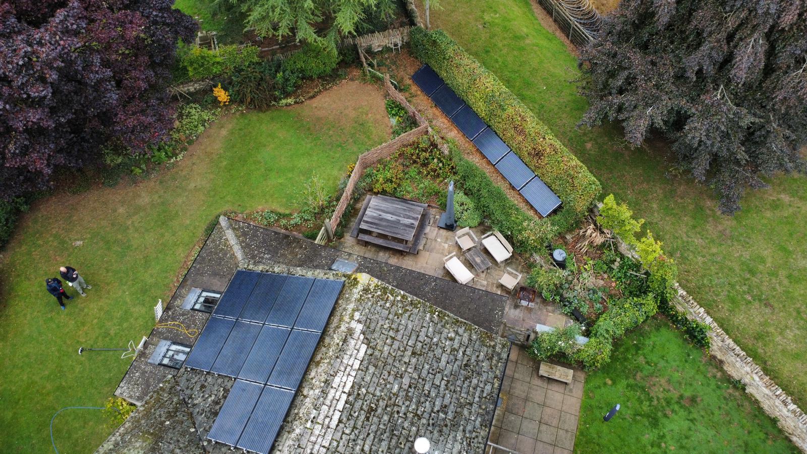 Solar Panels on the roof of a building in a town.
