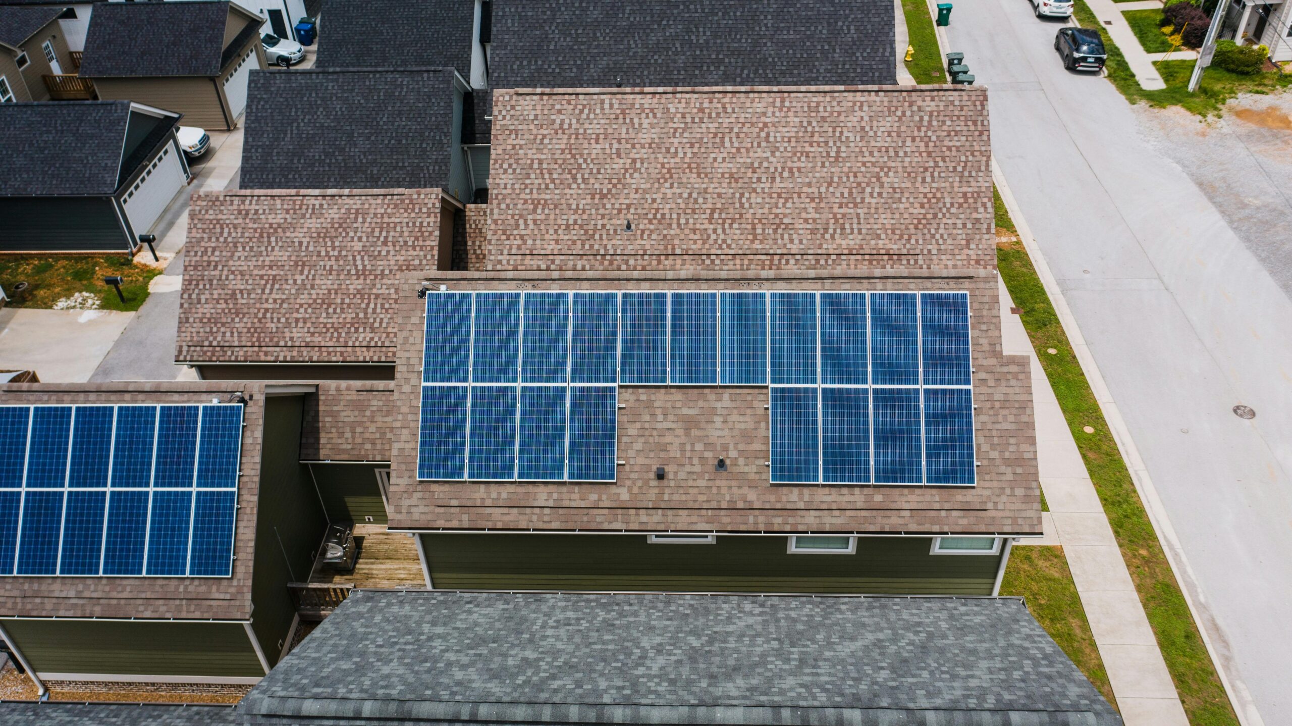 Solar panels on the roof of a modern looking house. Solar panels on the roof of a modern looking house.