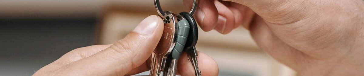 A landlord handing over the keys to a property.