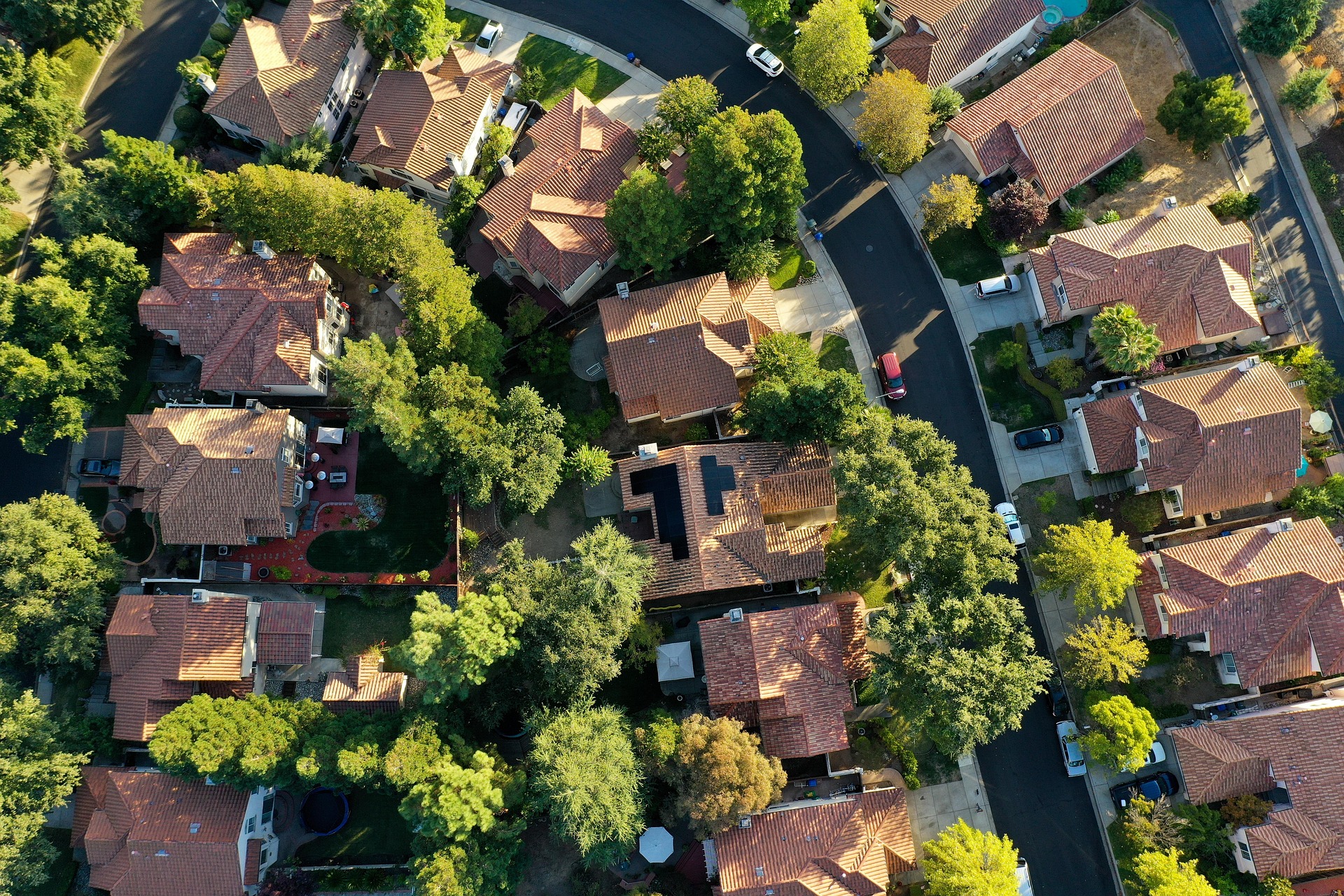 A house with solar panels on its roof is the only one in the street.