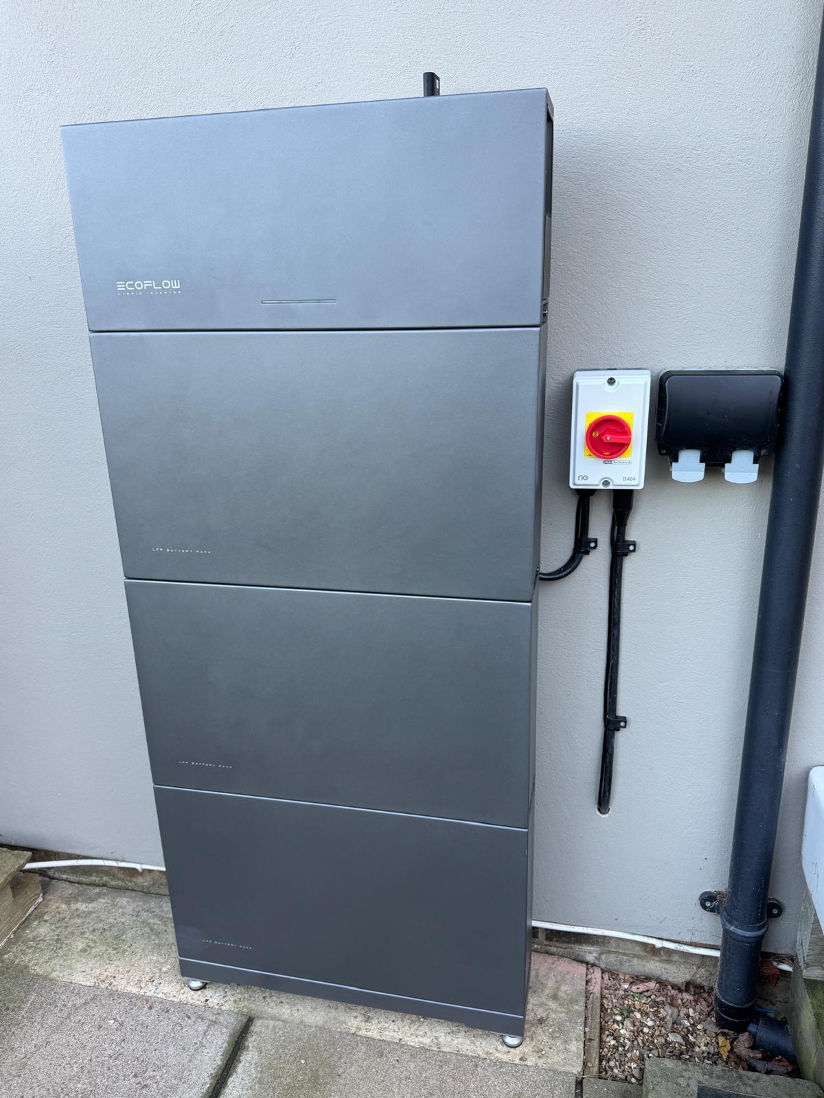 A silver solar battery system installed on a wall in leicestershire.