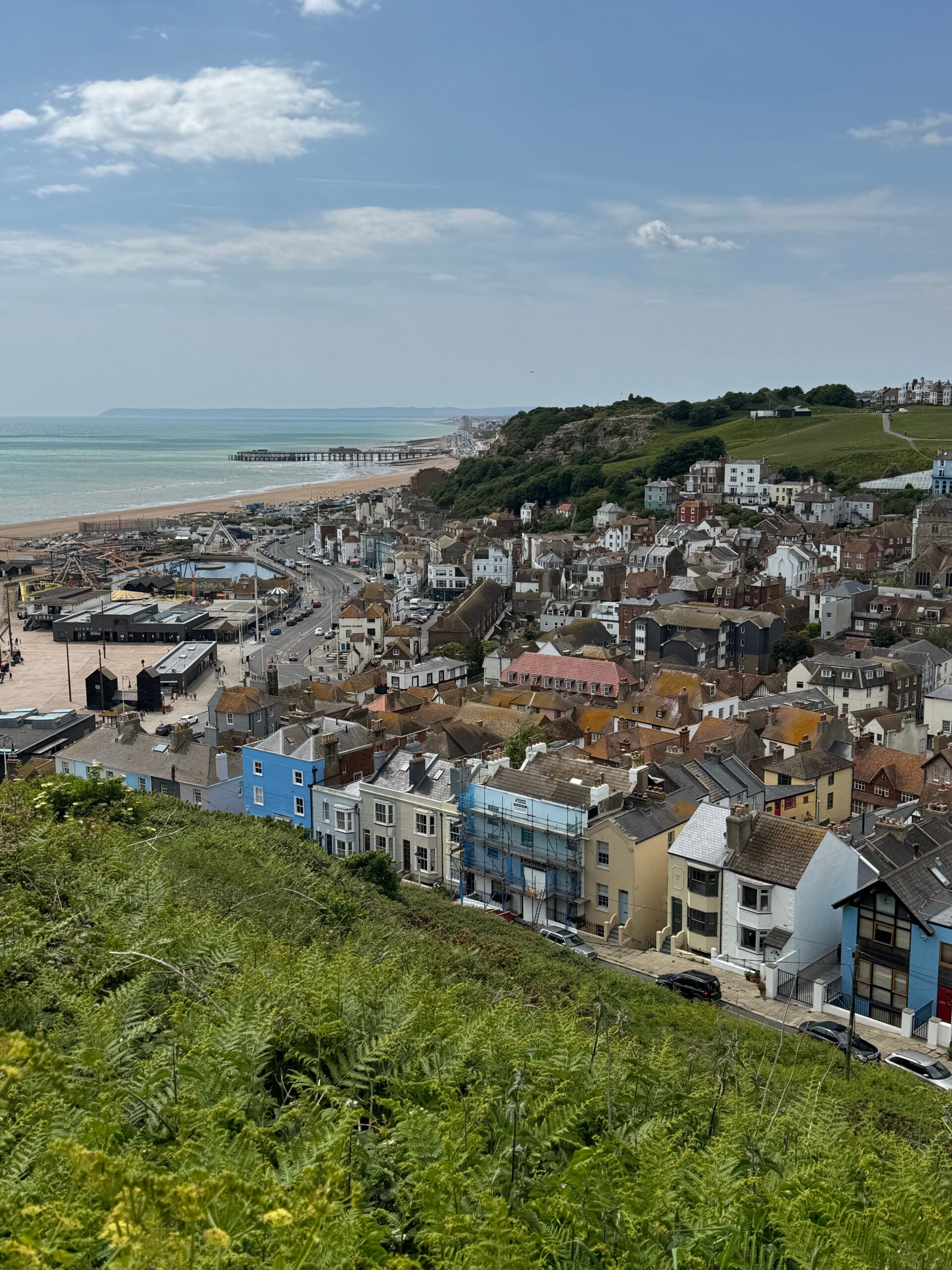 A picturesque view of Hastings Old Town with coastal landscape and historic architecture.