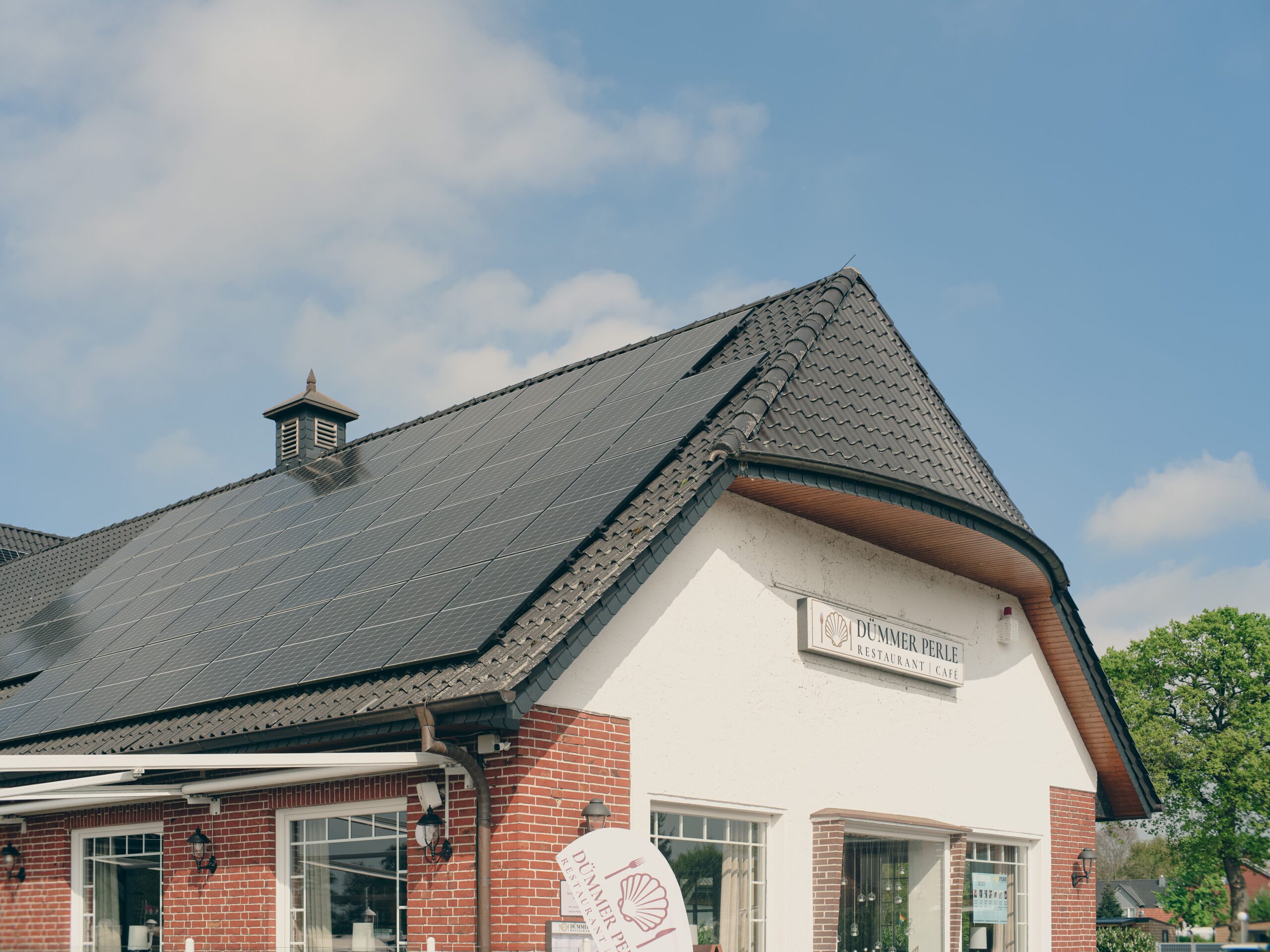 A bar and pub with solar panels on the roof.
